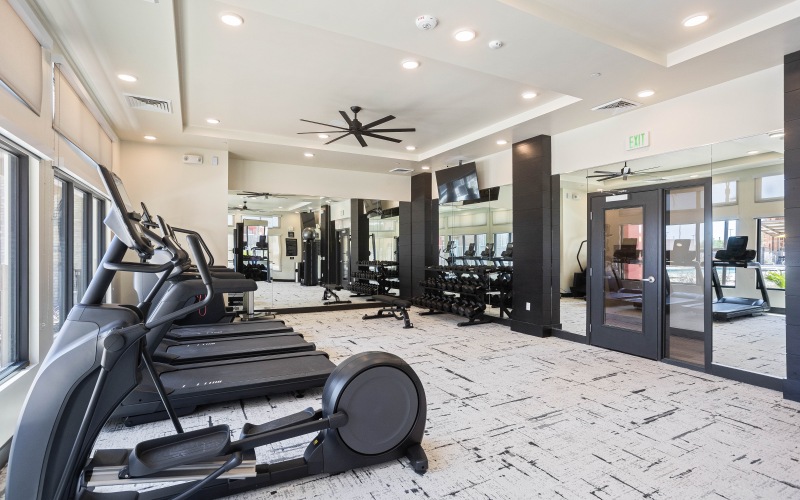 Gym / Workout equipment, ceiling fan, Large windows, Mirror on wall